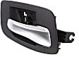 Front, Passenger Side Black bezel with silver lever Interior Door Handle