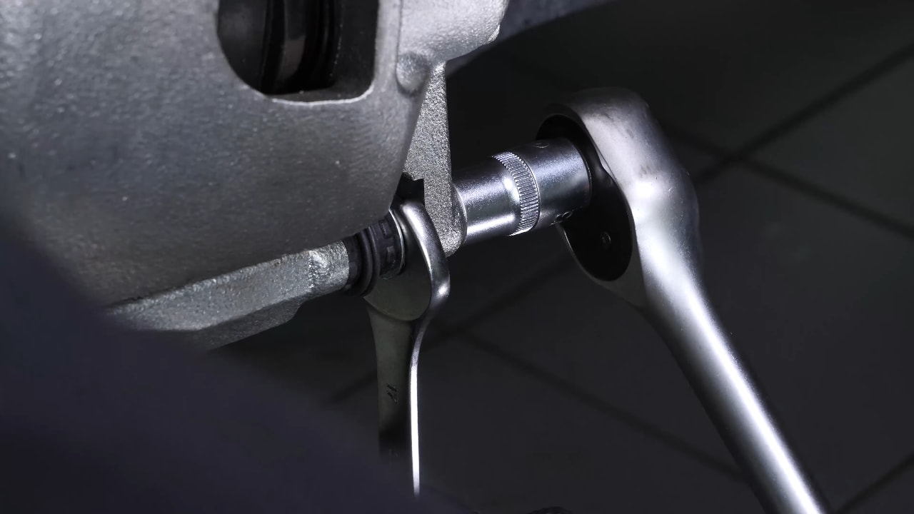 Put the brake caliper back