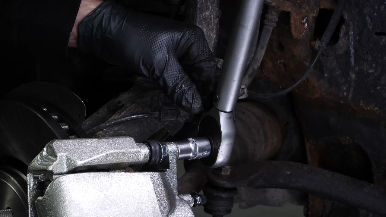 Put the brake caliper back