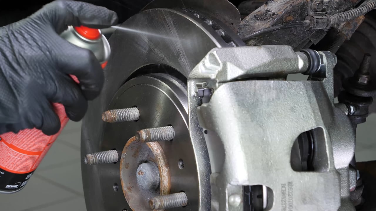 Put the brake caliper back