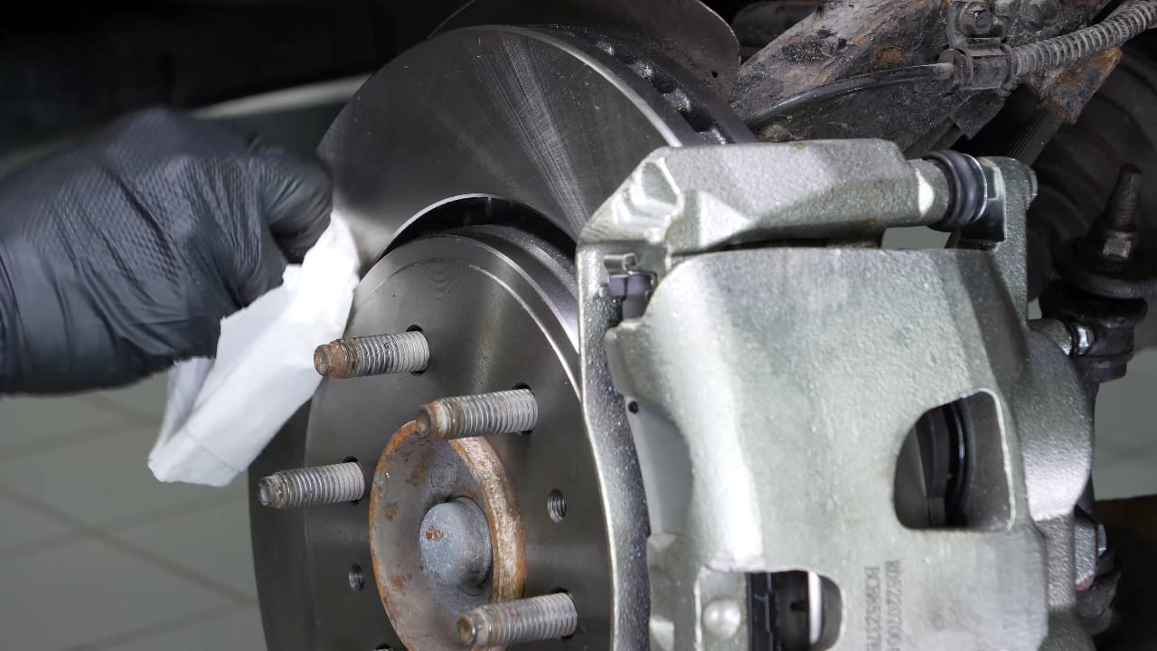 Put the brake caliper back