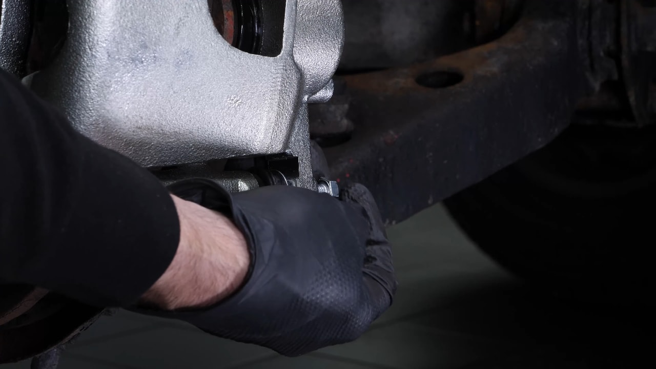 Remove the  brake caliper