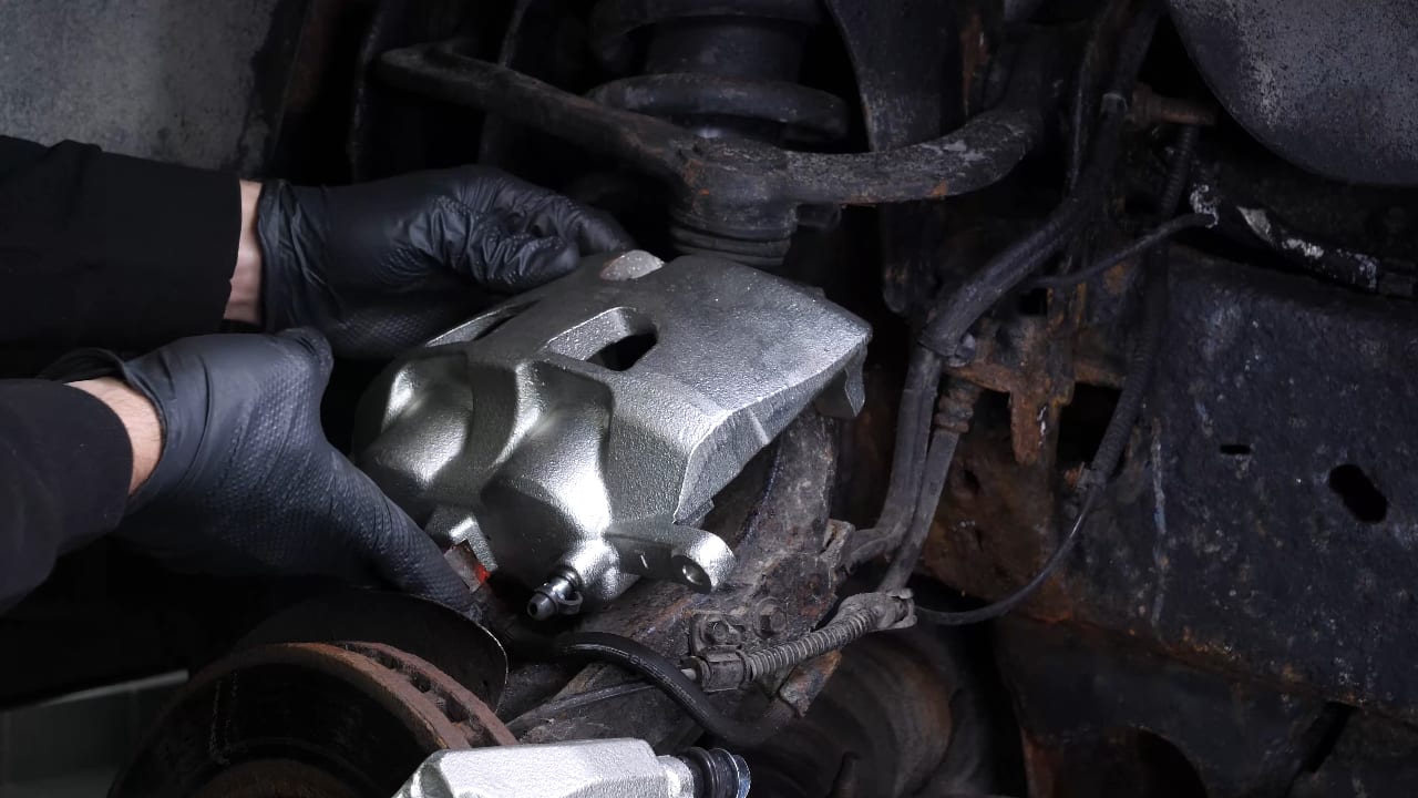 Remove the  brake caliper