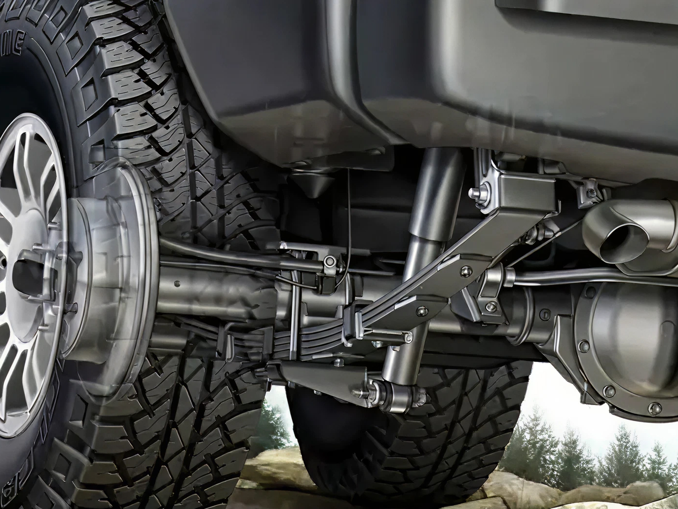 Close-up of a truck's rear leaf-spring suspension and axle after a leveling lift kit install