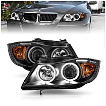 121335 Driver and Passenger Side Halogen Headlight, With bulb(s), Clear Lens, Black Interior, Halo Projector Series