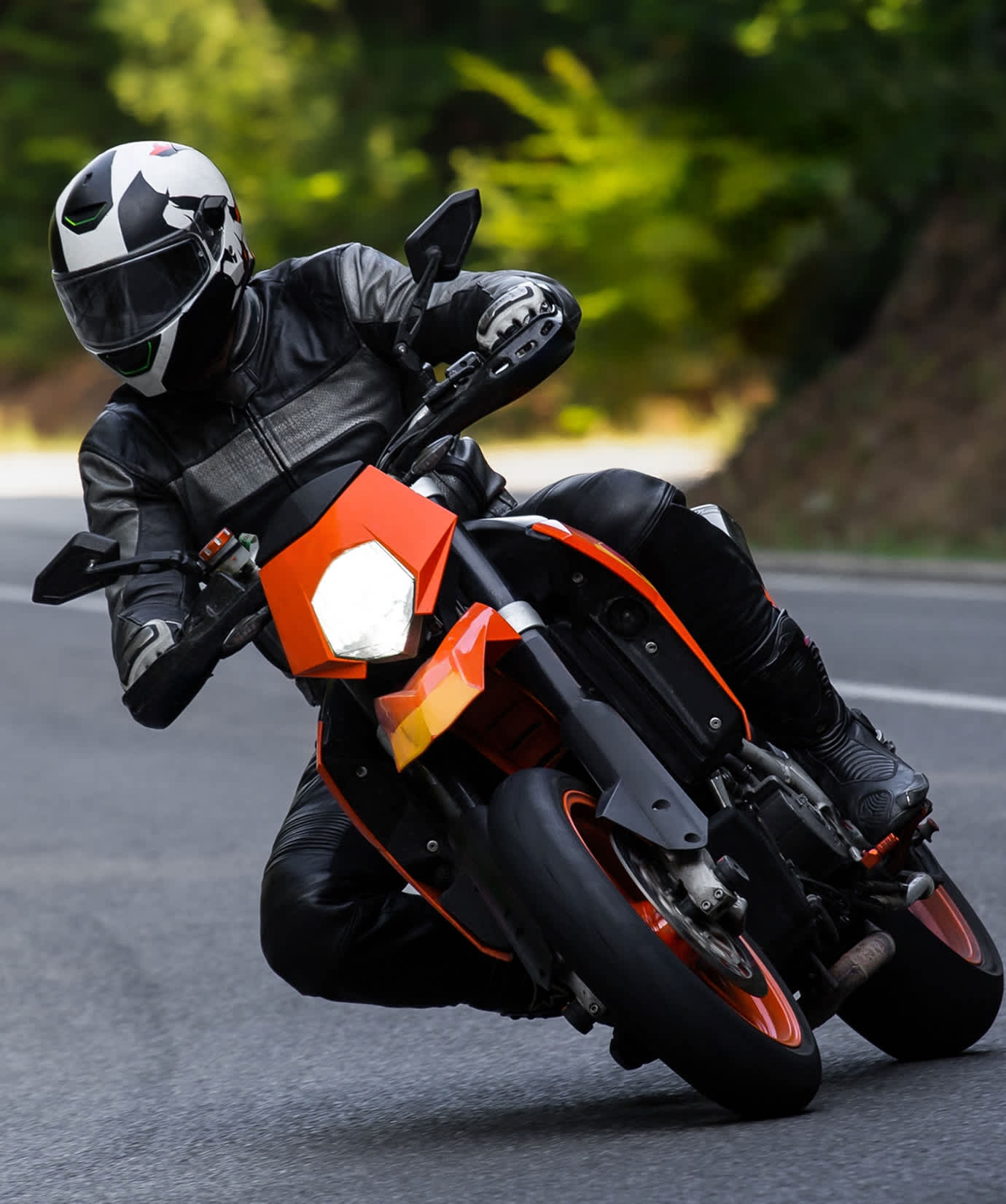 Rider leaning through a corner on a motorcycle