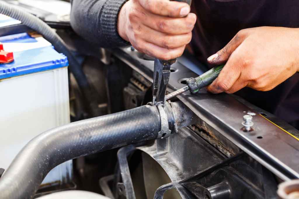 mechanic repairing a radiator